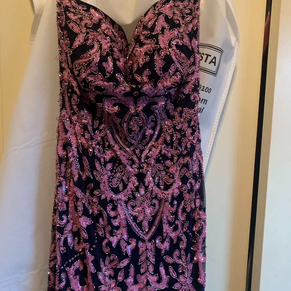This dress is a Sherri Hill size 12.